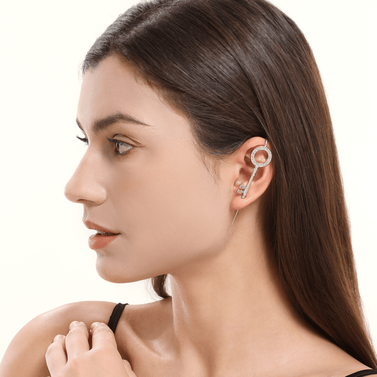 Unlocked Potential ear cuff in silver worn on the ear, profile view