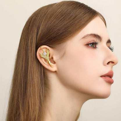 Cosmic Wand ear cuff worn on the ear, profile view