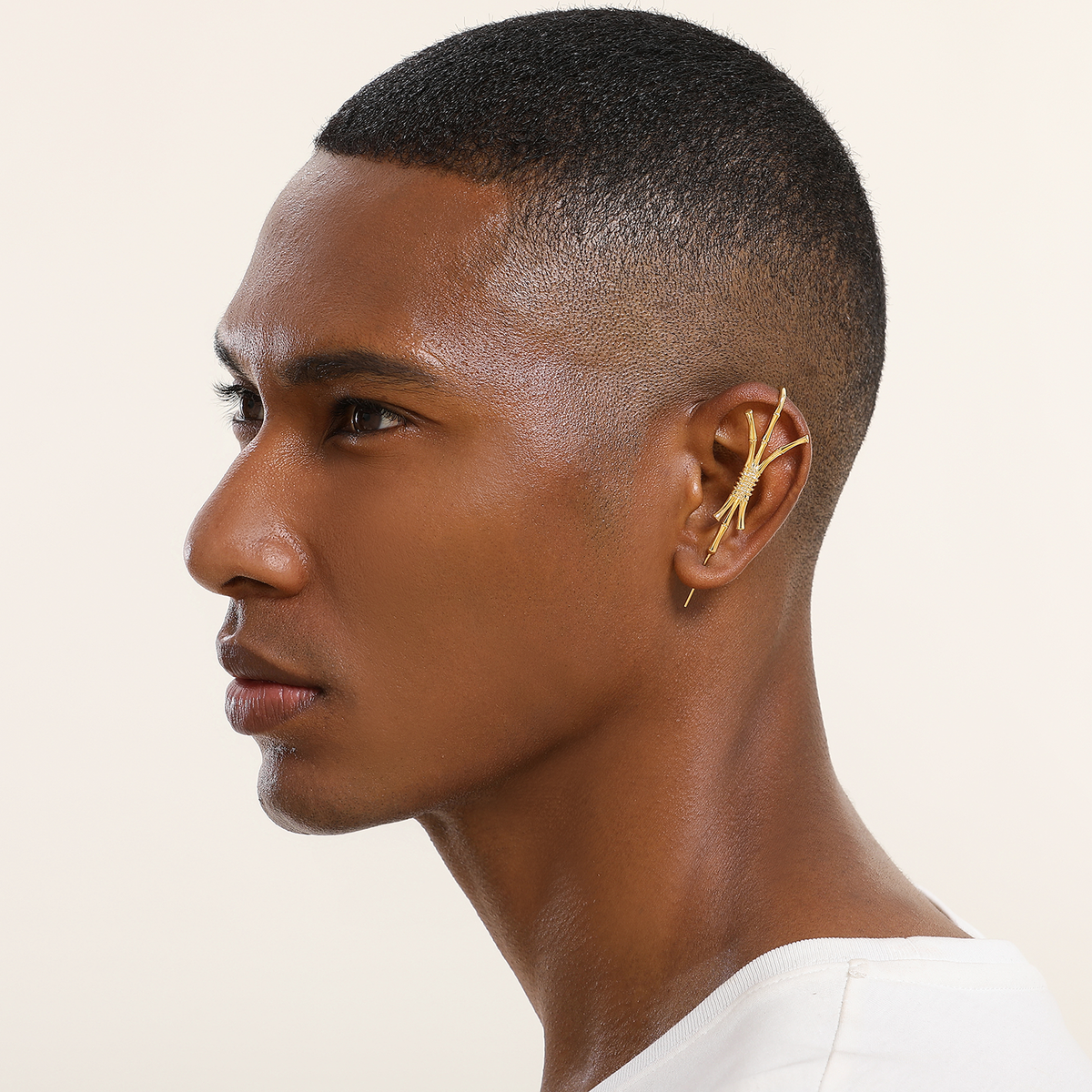 Ward of Protection ear cuff in gold worn on the ear, profile view