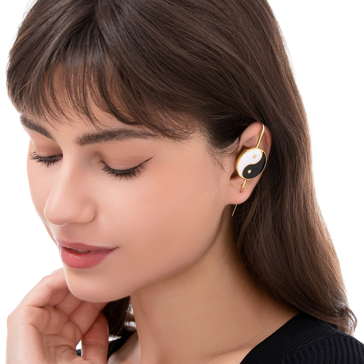 Yin & Yang ear cuff worn on the ear, profile view